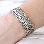 cuff bracelet with intricate stamped pattern